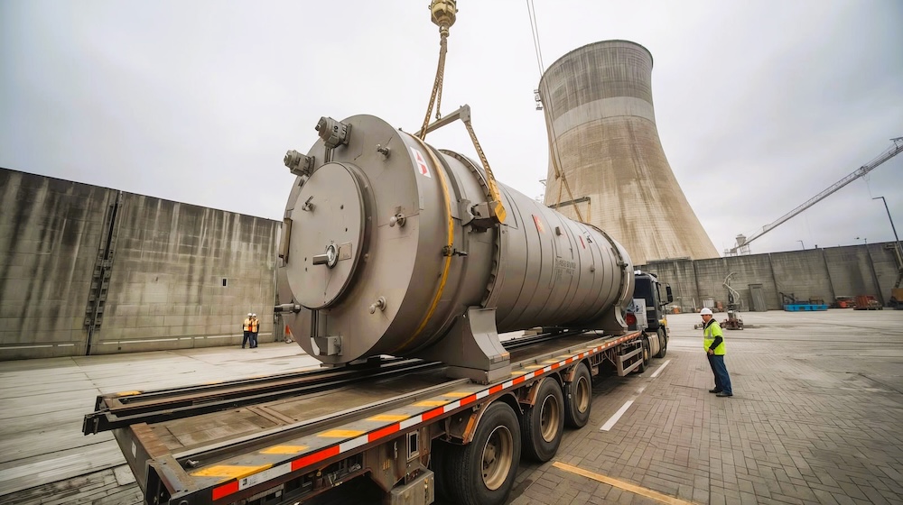 Specialized cargo vessel transporting a nuclear material container at sea